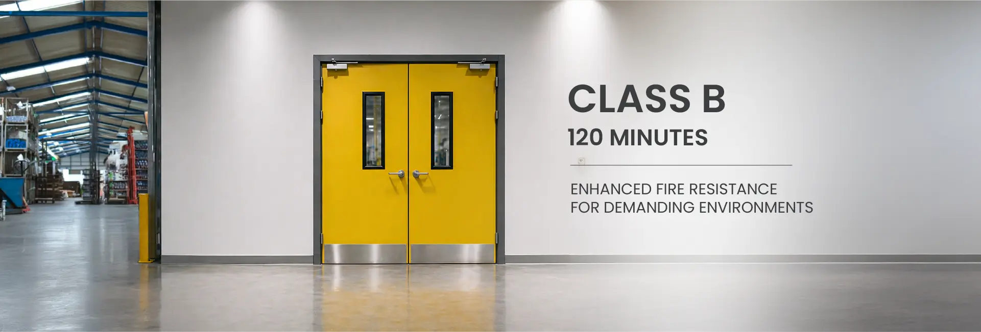 Yellow Class B 120-minute fire-rated double doors installed in an industrial warehouse environment.